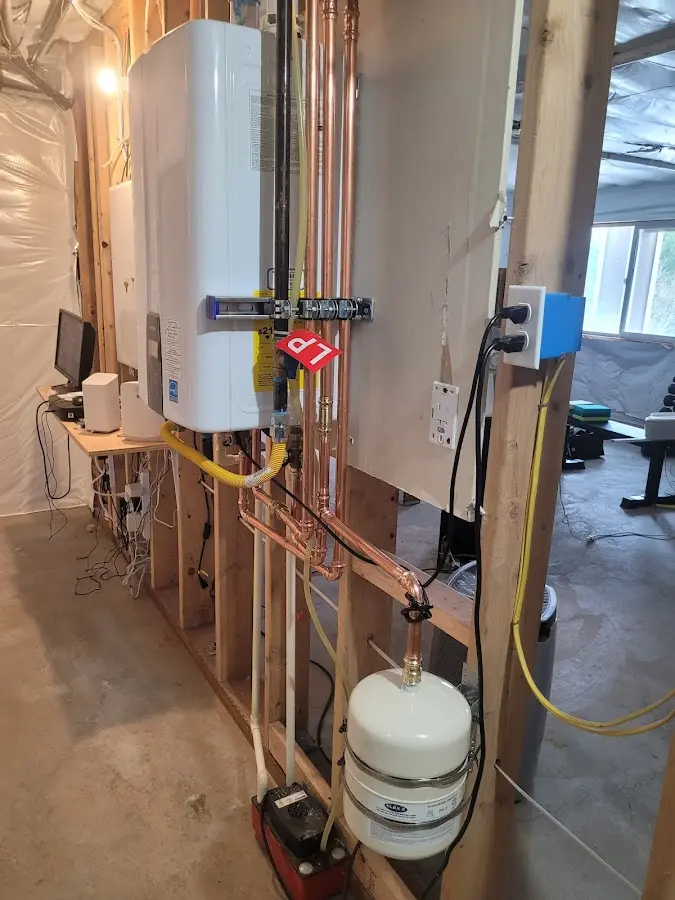 Licensed plumber repairing a kitchen sink in Belmont