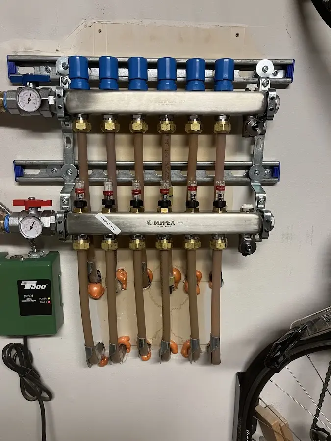 Plumber performing Water Heater Repair at a residential property in Belmont